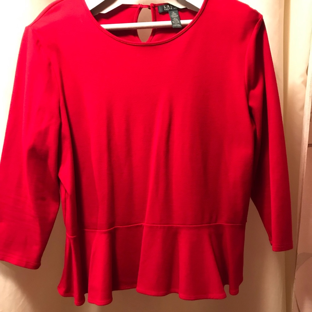 Ladies red blouse with 3/4 length sleeves.